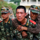 A paramilitary policeman carries an elderly man on his back after an earthquake hit Ludian county of Zhaotong, Yunnan province August 3, 2014. The magnitude 6.5 earthquake struck southwestern China on Sunday, killing at least 150 people in the remote mountainous area of Yunnan province, causing some buildings, including a school, to collapse, Xinhua News Agency reported. REUTERS/China Daily (CHINA - Tags: DISASTER) CHINA OUT. NO COMMERCIAL OR EDITORIAL SALES IN CHINA - RTR412QN